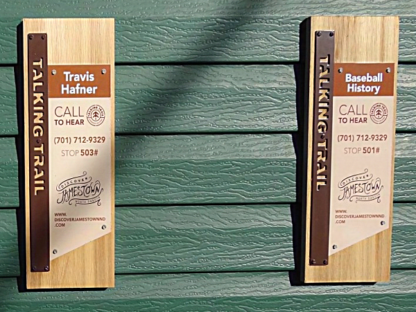 Two of the "Talking Trail" signs at Jack Brown Stadium 