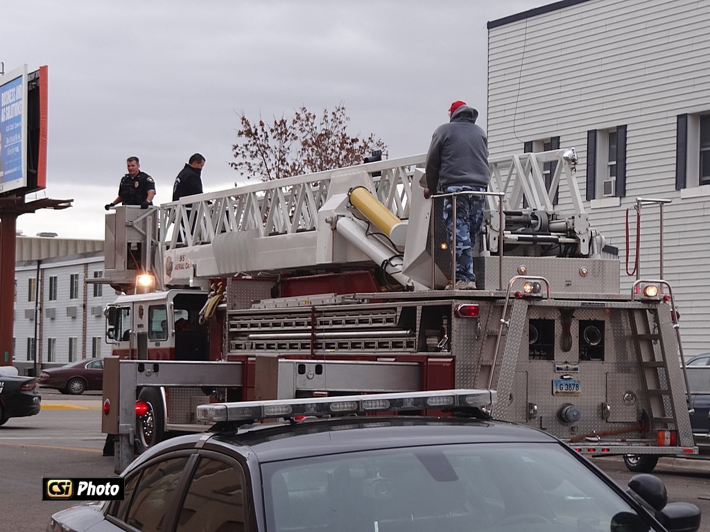 Jamestown Police & Fire Dept remove person from roof - CSi Photos