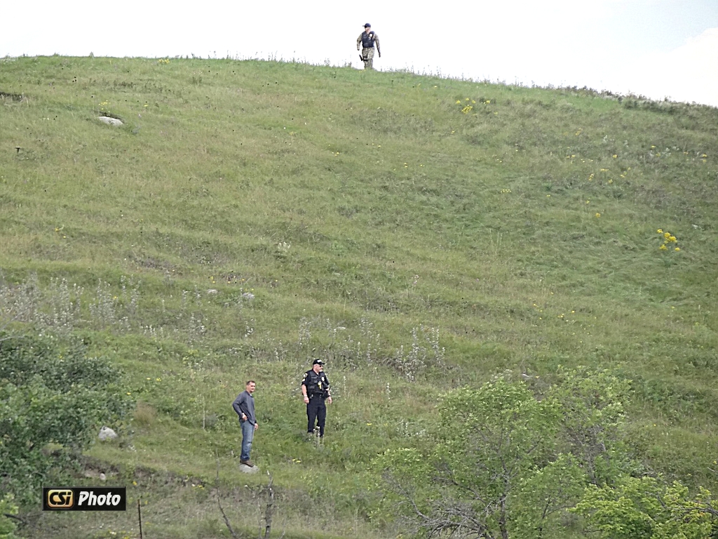 Police kept look out from top of hillside.   CSi Photo