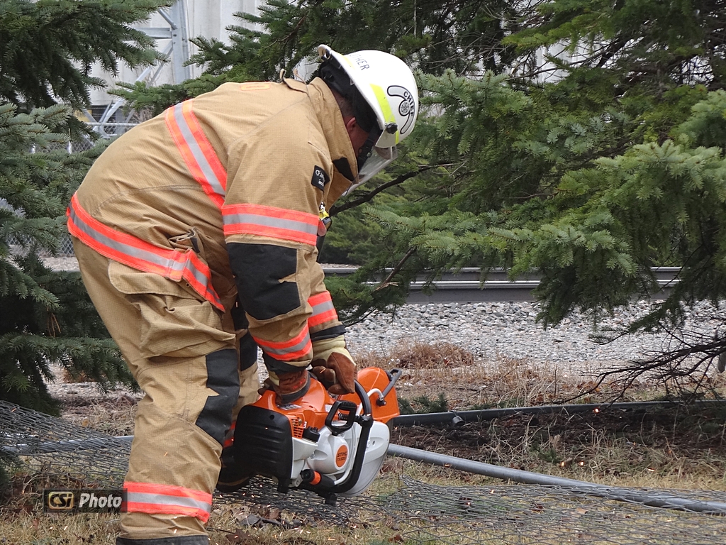 JFD cutting up bent and tangled fence railing.  More CSi Pixs at Facebook